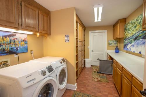 a laundry room with a washer and dryer at The Retreat at Mountain Meadows in Banner Elk