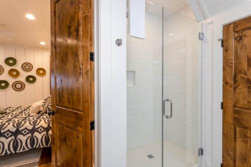 a bathroom with a shower and a glass door at Trouvaille in Blowing Rock
