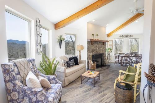a living room with a couch and a fireplace at Top Of The Hill in Seven Devils