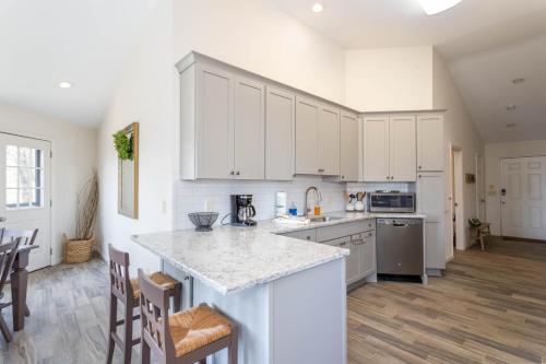 a kitchen with white cabinets and a counter top at Top Of The Hill in Seven Devils