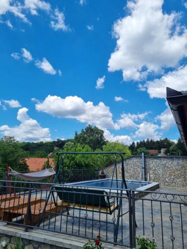 a trampoline on a deck with a blue sky at Pogled Vrdnik in Vrdnik