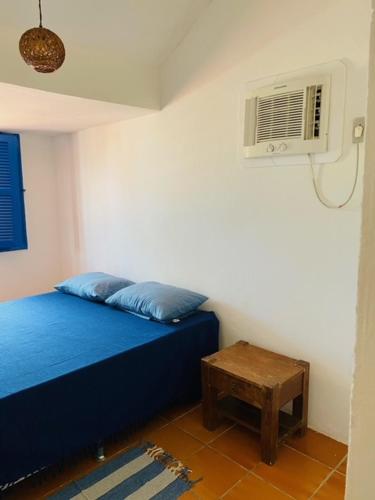Ένα ή περισσότερα κρεβάτια σε δωμάτιο στο Casa Tunis - poucos passos do mar