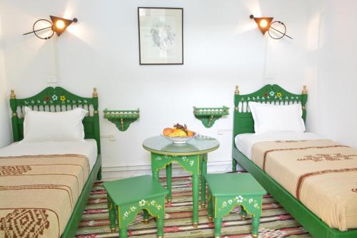Ein Bett oder Betten in einem Zimmer der Unterkunft Dar Ya