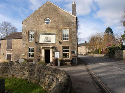 an old stone building on the side of a street at The Beeches - Chatsworth Apartment No 1 - Sleeps 2 in Baslow