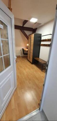 a room with a door and a room with a wooden floor at Geräumige Wohnungen Zentrumsnah Schwandorf in Schwandorf in Bayern
