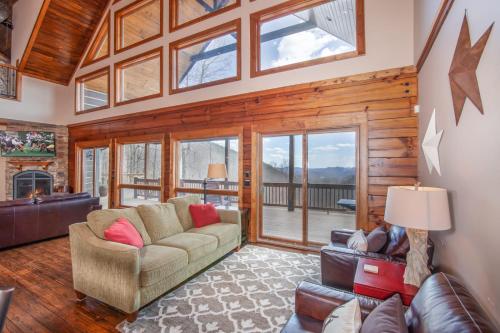 a living room with a couch and a fireplace at Blackberry Ridge in Blowing Rock