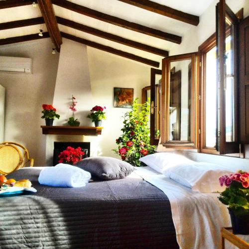 a bedroom with a large bed and a fireplace at Mia Palace in Florence