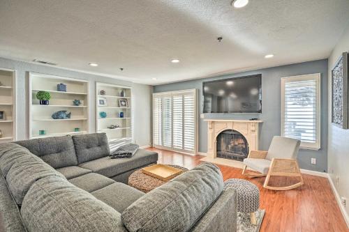 a living room with a couch and a fireplace at Less Than 1 Mi to Mussel Rock Park! Cliffside Pacifica Gem in Pacifica