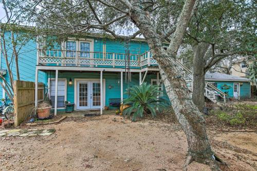 a blue house with a balcony on top of it at Walk to Coast Galveston Bay Retreat with Grill in San Leon