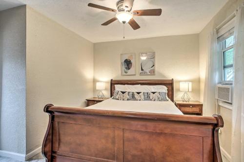 a bedroom with a bed with a ceiling fan at Walk to Coast Galveston Bay Retreat with Grill in San Leon