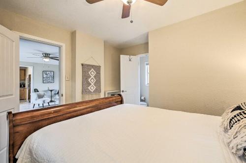 a bedroom with a bed and a ceiling fan at Walk to Coast Galveston Bay Retreat with Grill in San Leon