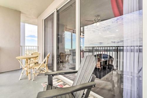 a balcony with a bench and a table and chairs at Family Resort Condo with 2 Pools 1 Mi to Disney! in Orlando