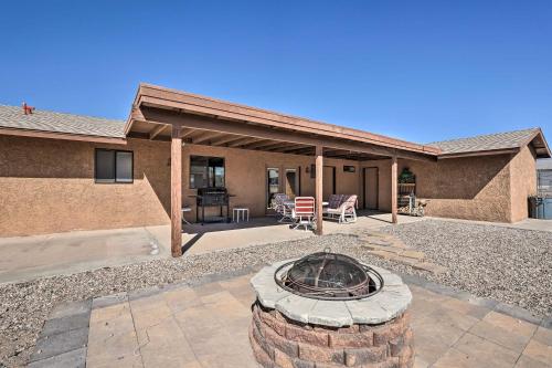 a home with a fire pit in the yard at 2 Mi to Lake Home with Fire Pit in Arizona! in Lake Havasu City