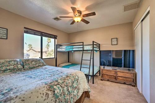 a bedroom with a bed and a bunk bed at 2 Mi to Lake Home with Fire Pit in Arizona! in Lake Havasu City