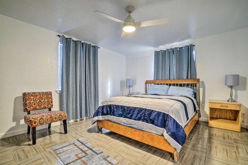 a bedroom with a bed and a chair at Central El Paso Home with Fire Pit! in El Paso
