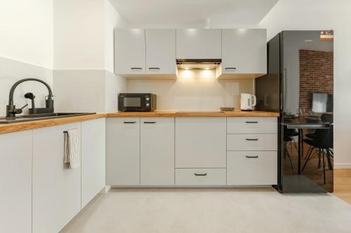 Η κουζίνα ή μικρή κουζίνα στο Aparthotel Plac Litewski Premium