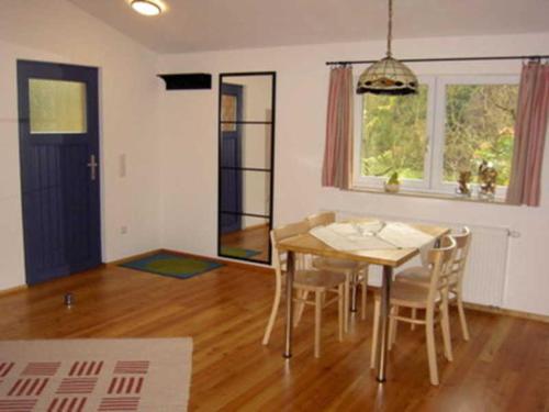 a dining room with a table and chairs at Ferienwohnung Albert in Kirchzell