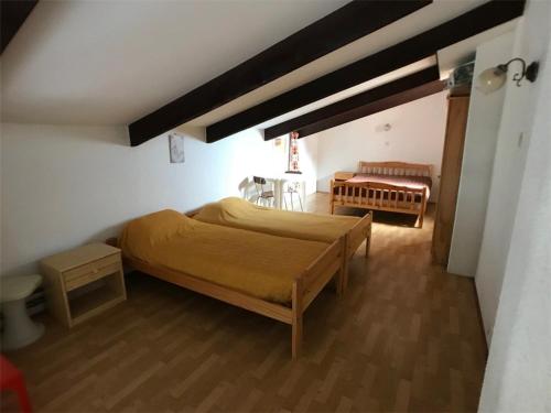 a bedroom with a large bed and a table at Appartement Port Barcarès, 2 pièces, 6 personnes - FR-1-81-243 in Le Barcarès