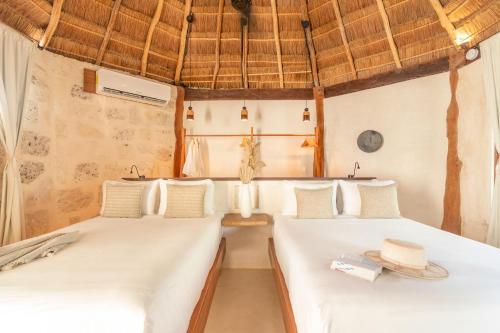 Katil atau katil-katil dalam bilik di Casa Ganesh Tulum-Beachfront hotel by Ahau Collection