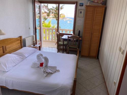 a bedroom with a bed with a swan decoration on it at Villa Maria in Lastovo