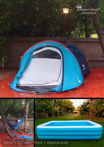 a tent is set up on a red table at Dreamland by Nature's Abode® Villas in Ahmedabad