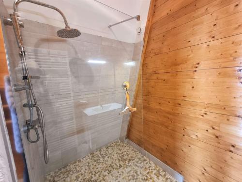 a bathroom with a shower with wooden walls at Appartement Saint-Michel-de-Chaillol, 2 pièces, 5 personnes - FR-1-393-6 in Saint-Michel-de-Chaillol