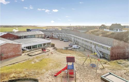 an aerial view of a building with a playground at One-Bedroom Apartment In Ringkobing in Ringkøbing