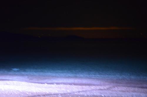 a view of the ocean at night at Apollon Hotel in Ancient Epidavros