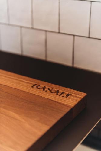 a wooden board with the word harley on it at Yonder Studio at Basalt Luxury Accommodation in Canobolas