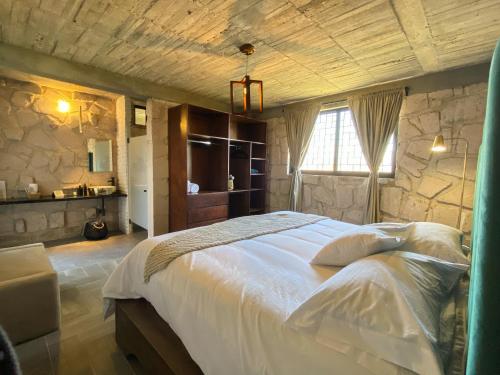 Postel nebo postele na pokoji v ubytování Dos Aguas Hotel Boutique