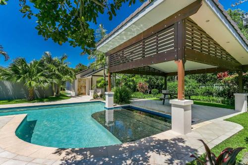 an image of a swimming pool in front of a house at Browning Street Sea Drift in Byron Bay