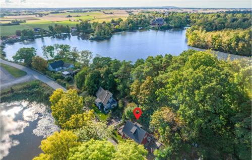 an aerial view of a house next to a river at Lovely Home In Munka-Ljungby With Wifi in Munka-Ljungby