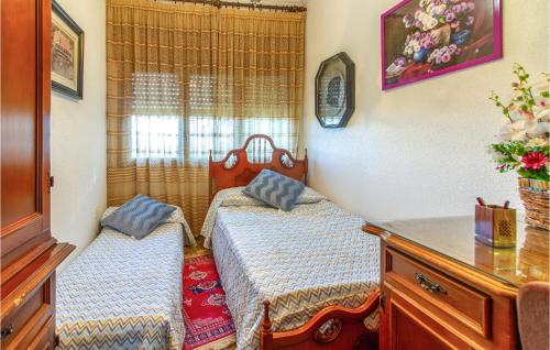 a bedroom with two beds and a dresser at 4 Bedroom Beautiful Home In Lorca in Lorca