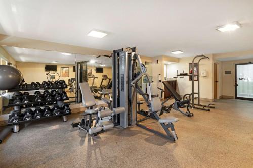 a gym with several treadmills and tread machines at Best Western Plus Madison-Huntsville Hotel in Madison