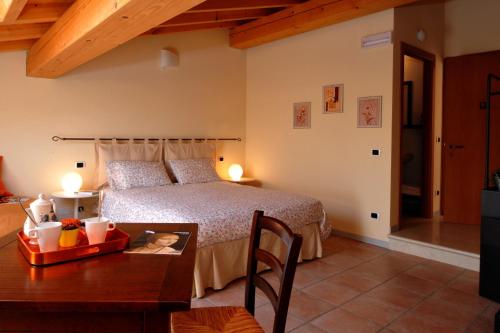 Postel nebo postele na pokoji v ubytování Agriturismo Al Barco