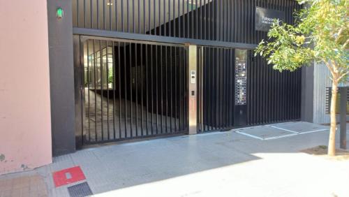 an entrance to a building with a black gate at Patagonia Home in Cipolletti
