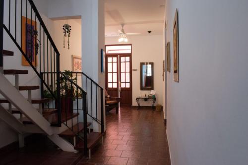 a hallway with a staircase and a stair case at Hostal Virgen del Rosario Cafayate in Cafayate