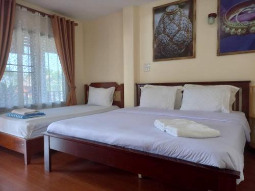 Llit o llits en una habitació de Welcome holiday