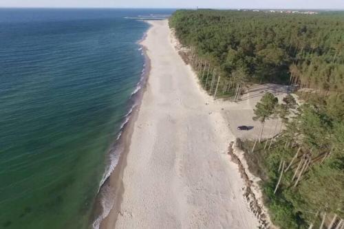 an aerial view of a beach near the water at Holiday homes for 6 persons, Rusinowo in Rusinowo
