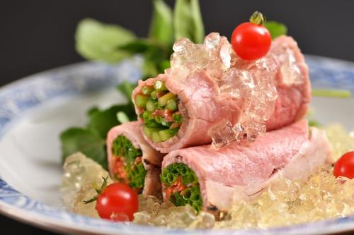 a sandwich with meat and vegetables on a plate at Muromachi Yutone Kyokoyado in Kyoto