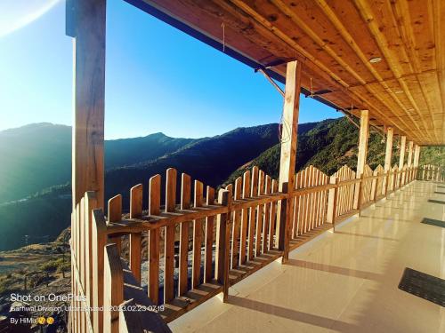 a balcony with a view of the mountains at Veda Inn in Chakrāta