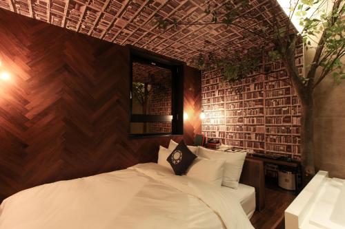 Katil atau katil-katil dalam bilik di Hotel Cullinan Geondae 1