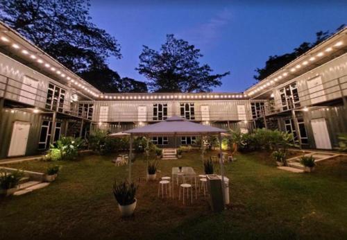 a large building with an umbrella in the yard at 1108 Carebin Slim River in Slim River