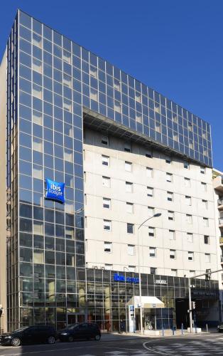 a large building with a sign on the side of it at ibis budget Nice Californie Lenval in Nice