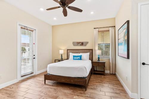 a bedroom with a bed and a ceiling fan at 3000 Latitude Lane in Orlando