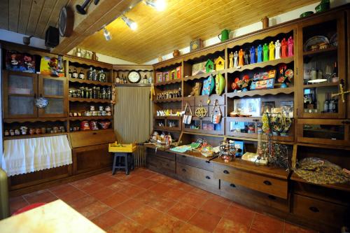 a room with shelves and a clock on the wall at Estalagem de Marvão in Marvão