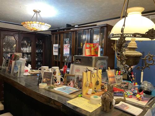 a counter with books and other items on it at Live Cafe Hisui no Umi in Itoigawa
