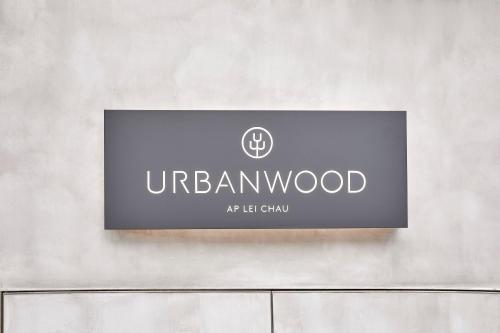 a sign on a wall that reads uraniumwood at left club at Urbanwood Ap Lei Chau in Hong Kong