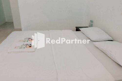 Ένα ή περισσότερα κρεβάτια σε δωμάτιο στο Ken Zong Inn Hotel