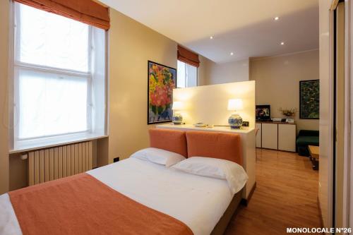 Una cama o camas en una habitación de Residence Sacchi Aparthotel